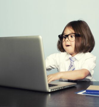 young girl wearing tie types on laptop 155394756 5b384c3c46e0fb00375dc7f4